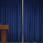 A Indoor Pole of Brass Standing On a Stage