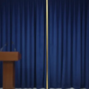 A Indoor Pole of Brass Standing On a Stage