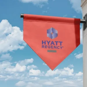 Wall mounted flag displayed on a building exterior