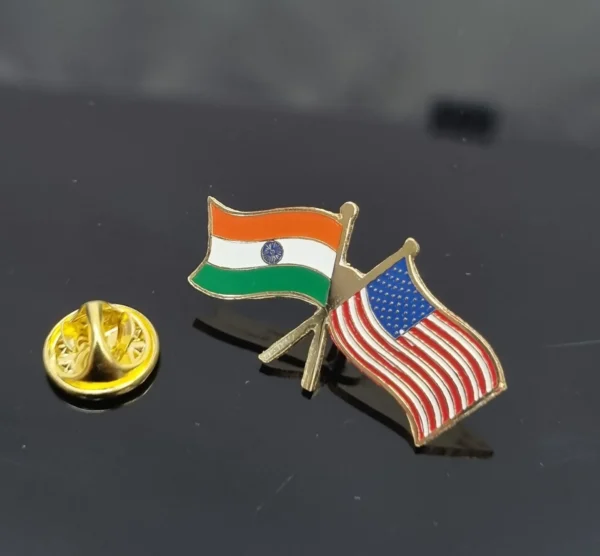 Lapel pin featuring crossed India and USA flags with a separate gold clasp