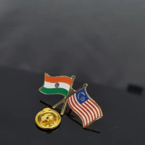 Crossed India and Malaysia flag lapel pin with a gold clasp.