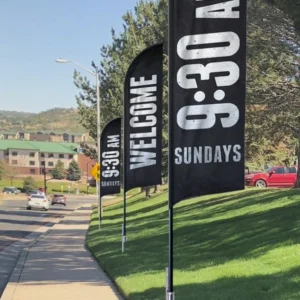 feather flags sign welcomes