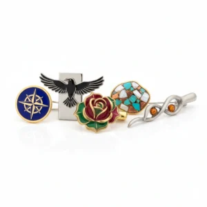 Decorative lapel pins featuring a compass, bird, rose, mosaic, and silver design