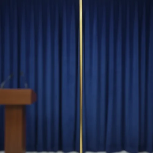 A Indoor Pole of Brass Standing On a Stage